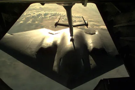 A B-2 Spirit being refueled by a KC-10 aircraft.