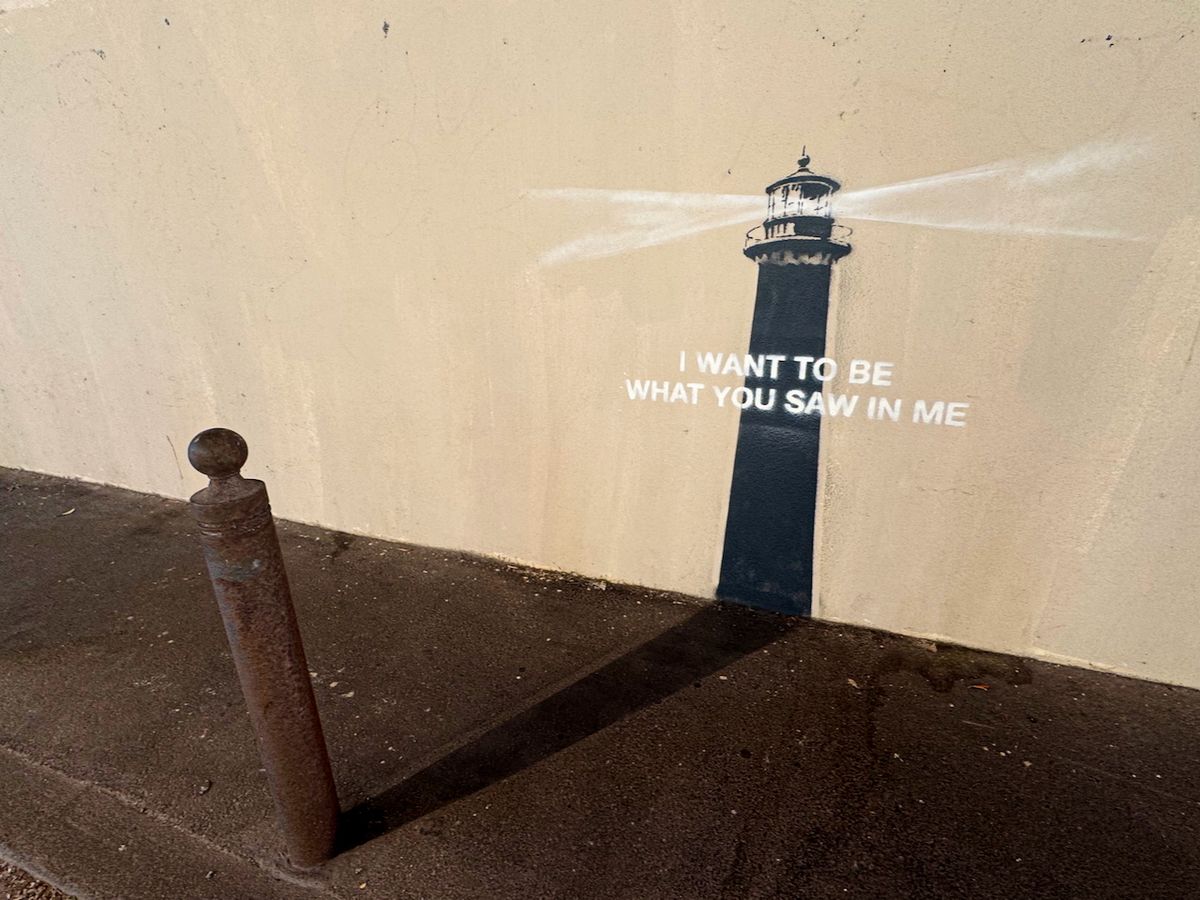 Banksy's lighthouse mural with text: 'I WANT TO BE WHAT YOU SAW IN ME'