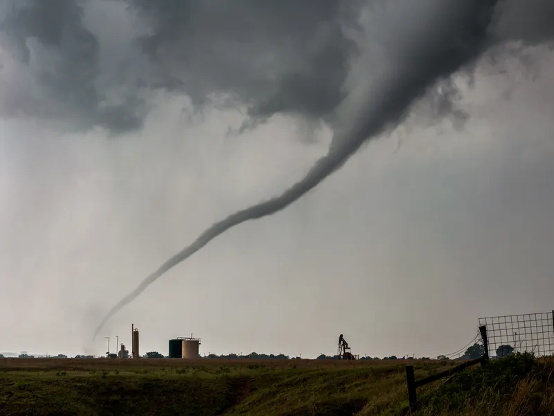 In the heart of America's tornado alley, a menacing, ropeshaped funnel