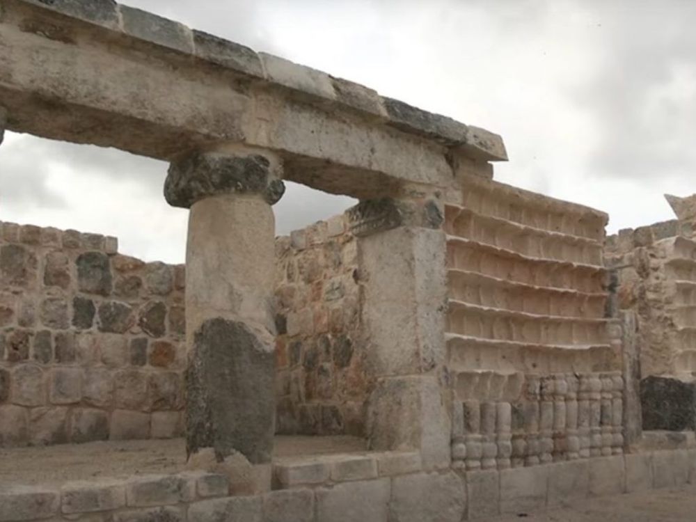 A Maya temple with stairs and columns