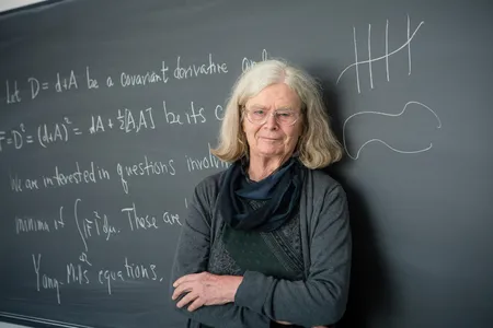 Uhlenbeck's work on minimal surfaces was instrumental to the foundation of the mathematical field of geometric analysis