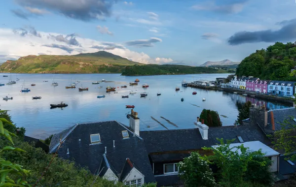 The sun sets over Portree Harbor, Isle of Sky. thumbnail