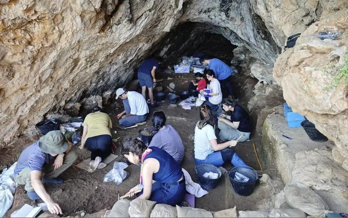 Researchers excavating a cave