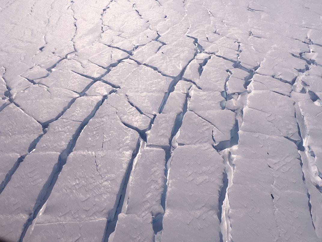 crisscrossing cracks in ice