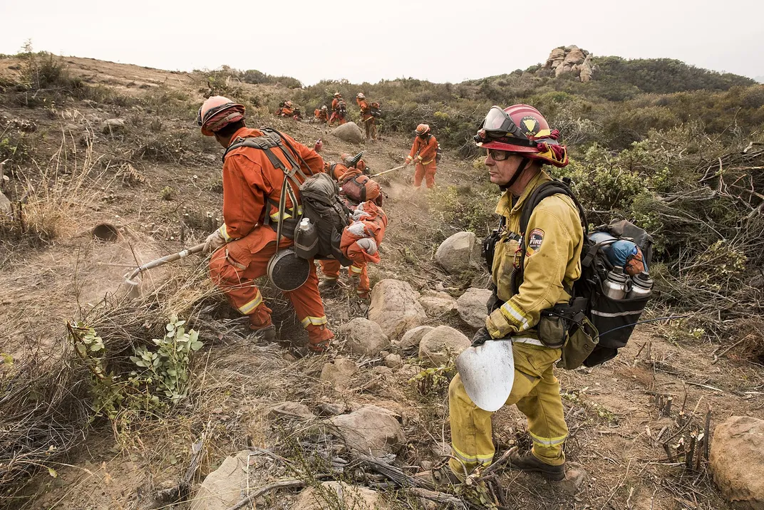 Incarcerated firefighters clear a fire line near Santa Barbara, California, in December 2017