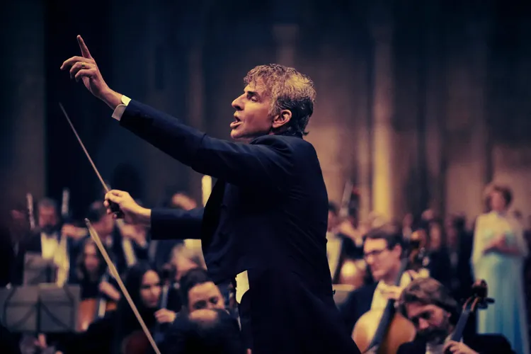 Bradley Cooper as Leonard Bernstein, conducting