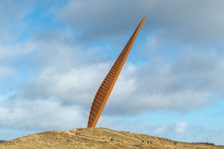 The winning design features an 180-foot, 200-ton steel column jutting out of the Northumberland hillside at a roughly 30-degree angle.