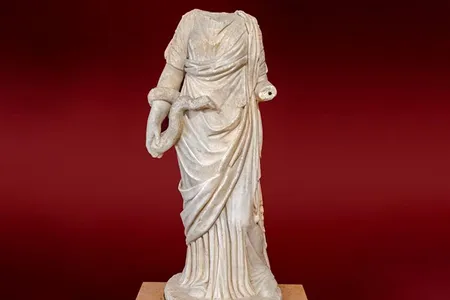 A different headless statue of health goddess Hygieia