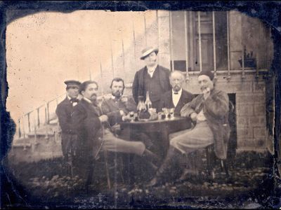 According to some scholars Vincent Van Gogh sits third from the left in this photograph. Surrounding him are artist Emile Bernard, politician Félix Jobbé-Duval, actor André Antoine and artist Paul Gauguin. 