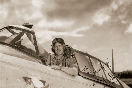 Lieutenant John Payne mailed this publicity photo of himself posing in the cockpit of a Republic P-47D home to his grandfather.