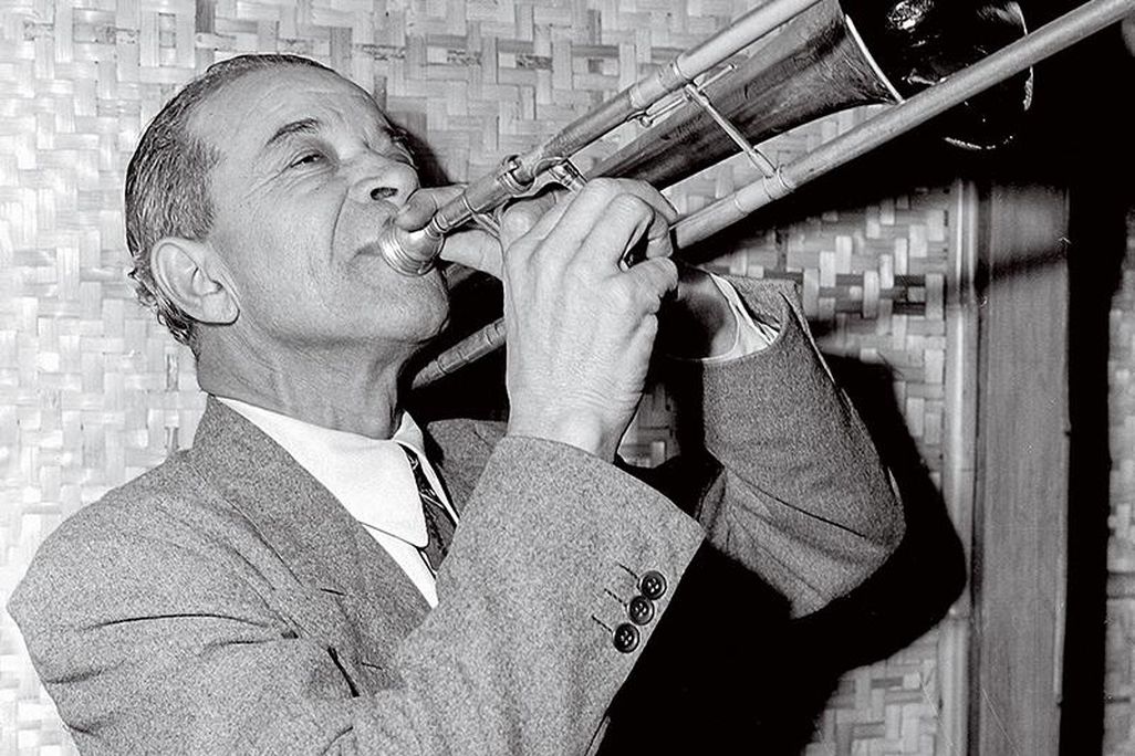 Kid Ory plays the trombone.