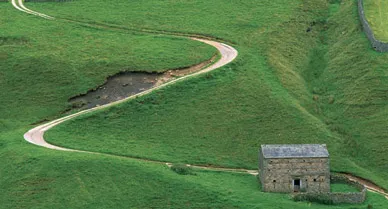 "In these fields and lanes," says author Michael Parfit of the Coast to Coast walk, "the past seemed close enough to touch, as if seen in a pool of clear water. And in a way we did touch it, because we shared its means of travel." The countryside outside Keld (above), in Yorkshire Dales National Park, is one of the most evocative lengths of the two-week trek.