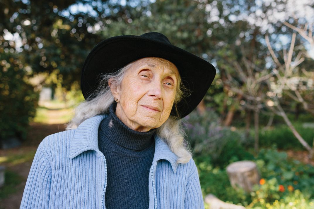 a women in blue sweater and black hat