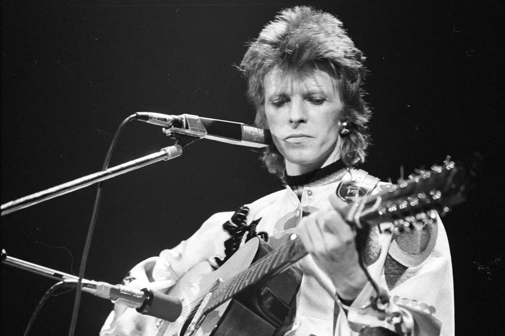 David Bowie performs onstage during his "Ziggy Stardust" era in 1973 in Los Angeles, California.