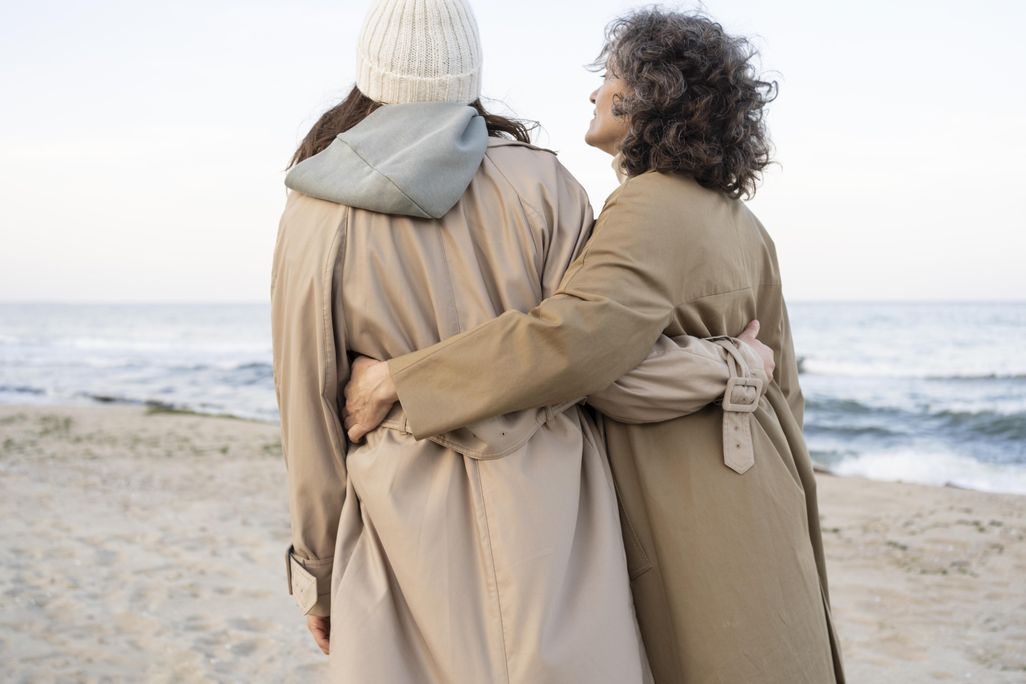 an older woman walking with a seemingly younger woman