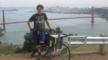 The author and his bike stand about 850 feet above San Francisco on Conzelman Road. Repeated 10 times, this little hill amounts to a world classic of climbing.