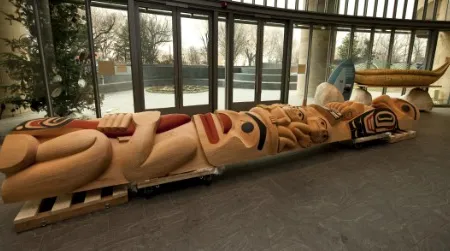 The Boxleys' totem pole, "The Eagle and the Chief," is currently being completed by the artists on public view in the Potomac Atrium of the American Indian Museum.