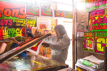 Monky’s street posters have become synonymous with the syncopated, high energy beat of a music genre, called Chicha.