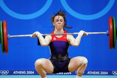 Tara Nott Cunningham attempts a snatch during the 2004 Olympic Games in Athens.