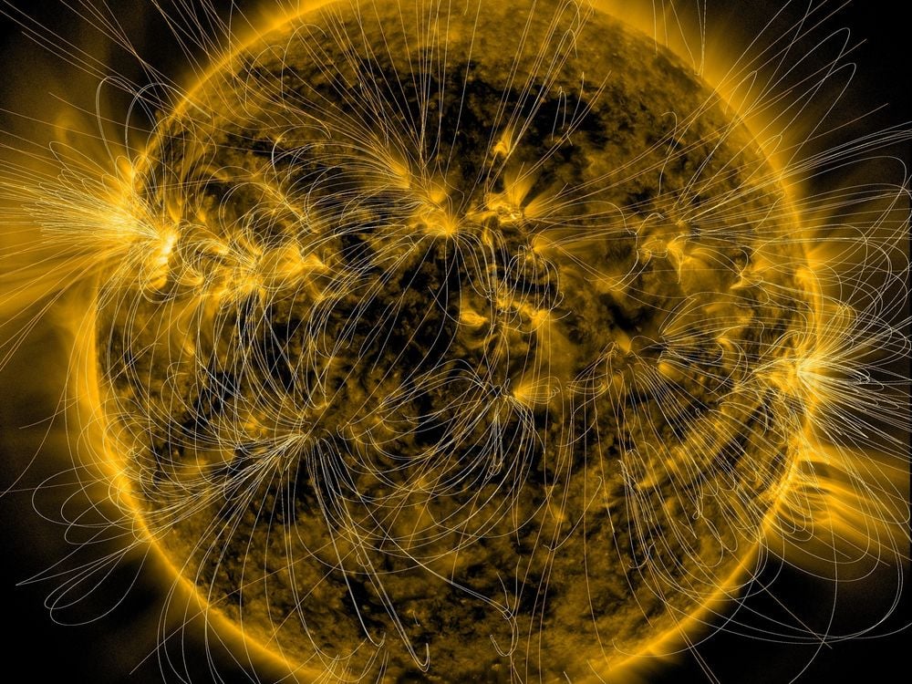 the yellow glowing sun with thin loops drawn coming off of it, concentrated around bright spots and more centered around the middle of the star, rather than its poles