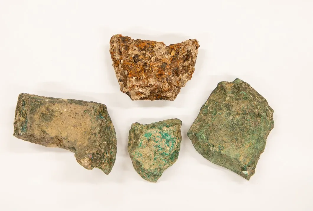 Fragments of material against a white backdrop