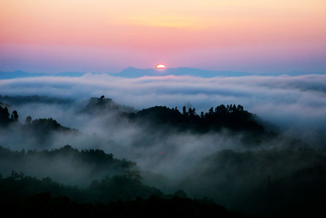 Beautiful sunrise view. Clouds on one side and the sun rising over the ...