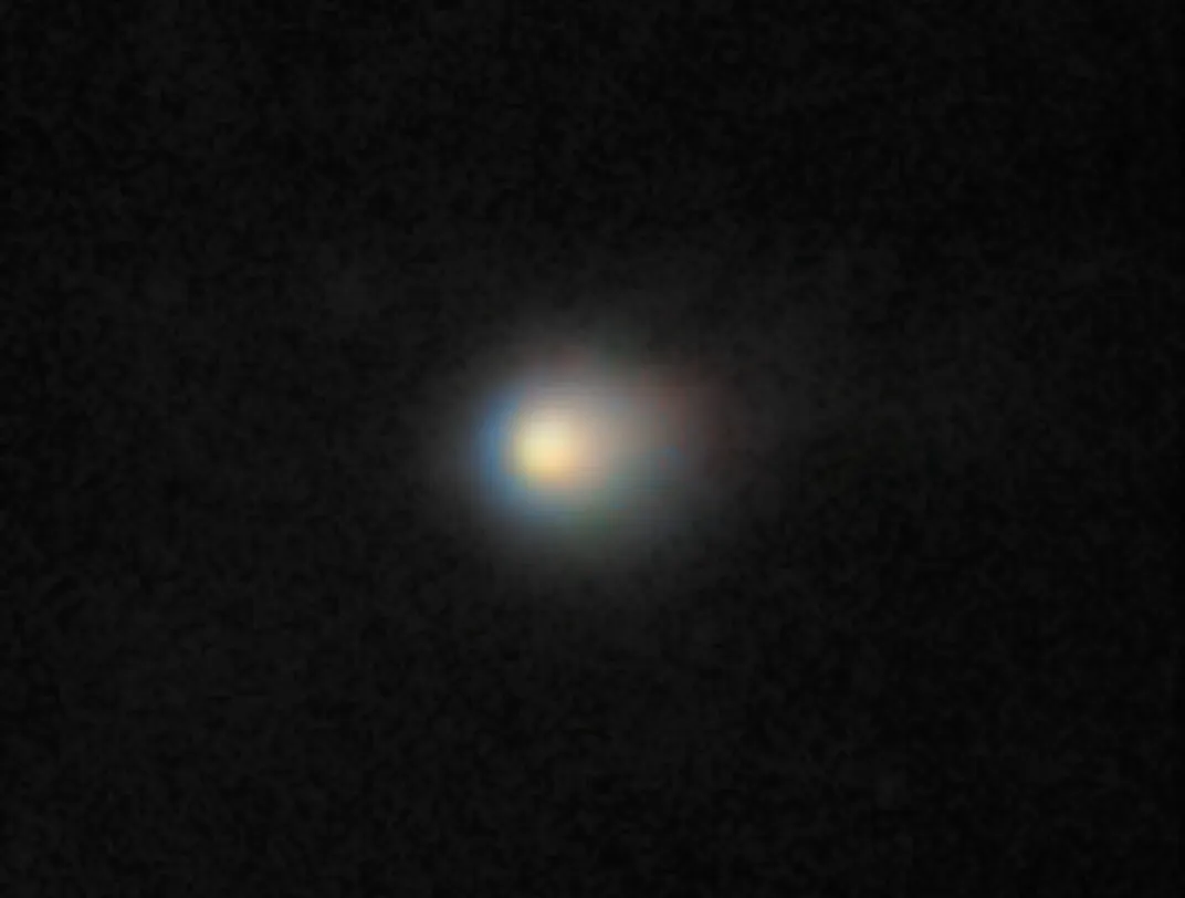 a glowing orb in a dark sky