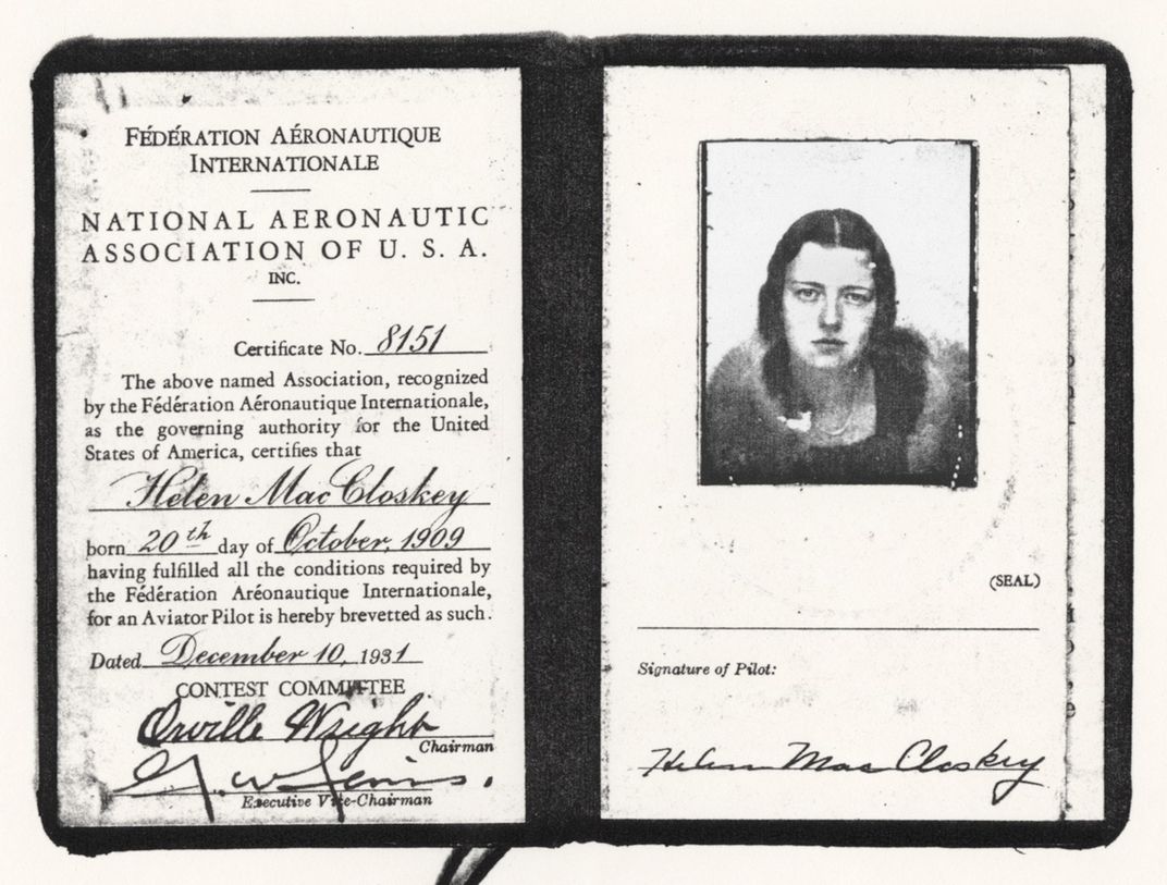 A photocopy of a pilot's license booklet with a signature page on the left and a thumbnail photo of a woman on the right page