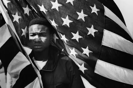 In the aftermath of the Civil War, more than four million newly freed Blacks sought fulfillment of the promises laid out in the U.S. Constitution. Says Kinshasha Holman Conwill, NMAAHC&#39;s deputy director: &quot;The shadow of Reconstruction is a long shadow.&quot; (Above: Lewis &quot;Big June&quot; Marshall carries the flag during the Selma to Montgomery March in 1965.)