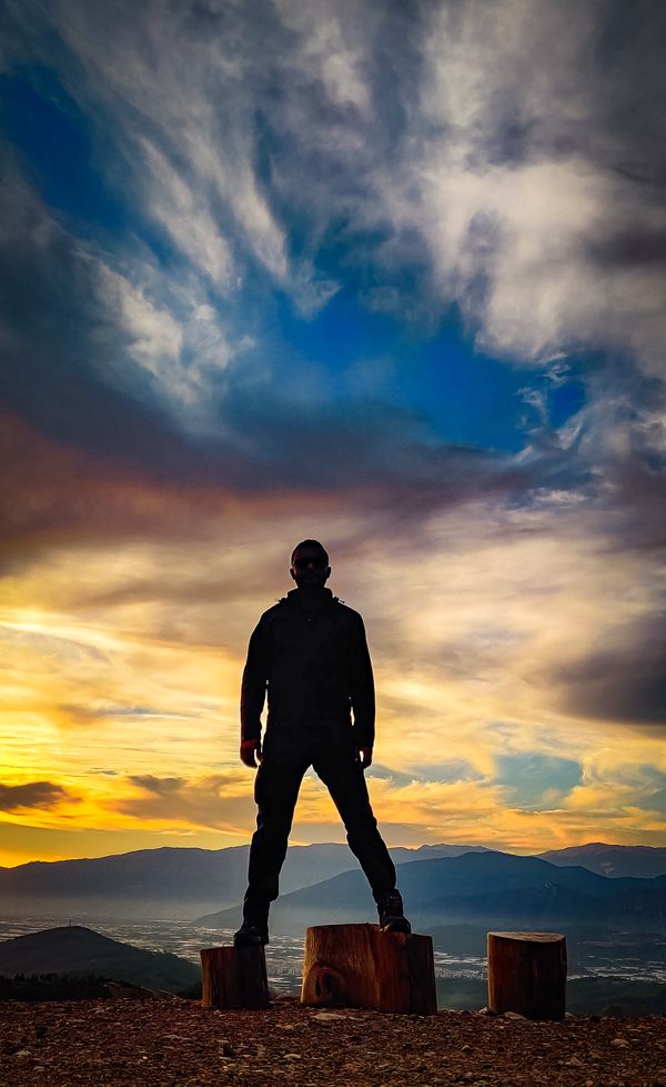 A man on the top of a mountain thumbnail