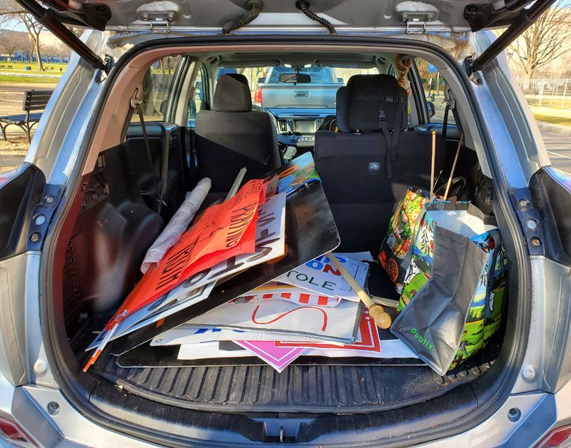 The open trunk of a car filled with collected items