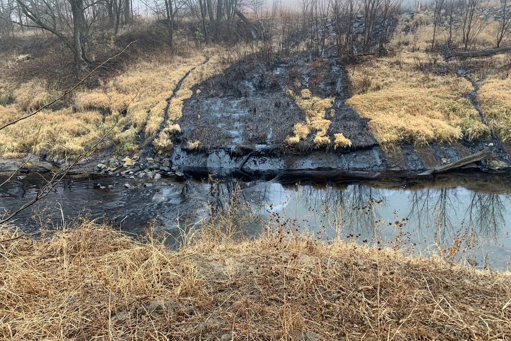 oil spill into a creek