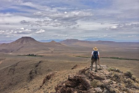 A geologist looks out into a caldera in Nevada's McDermitt Volcanic Field.