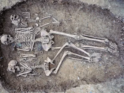 Grave 109 at Oakington is a rare triple burial, holding the remains of a female infant, a young woman (left) and an older woman (center). 