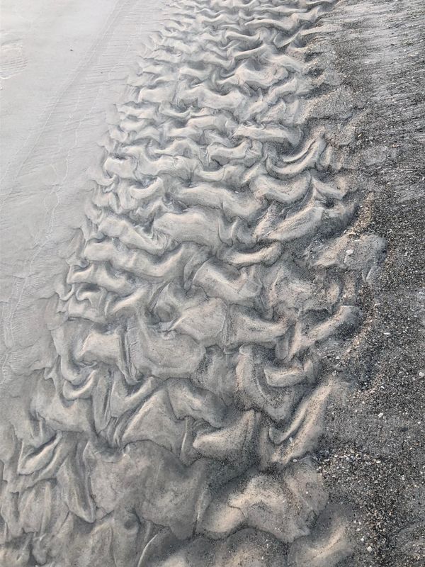 Sand leaves psychedelic ripple impressions on a Florida beach thumbnail