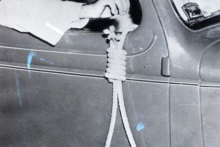 A member of the Ku Klux Klan holds a noose during attempts to suppress black voters in Miami, Fla., in 1939. 