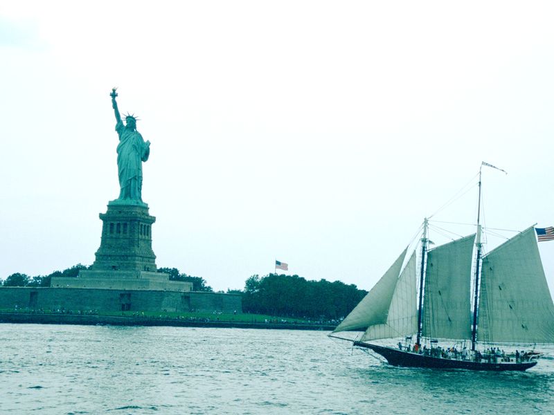 Liberty Tall ship passes the statue of liberty, timeless photo of a