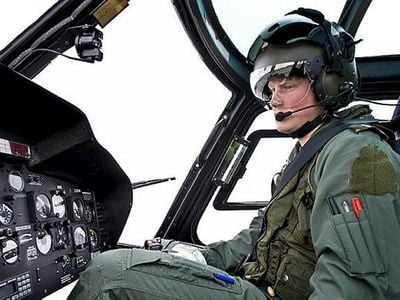 Britain’s Prince Harry checks out the controls from the right seat of a Eurocopter AS350 (Squirrel) helicopter.