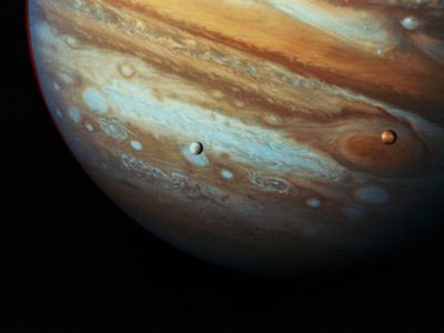 Jupiter with moons Io and Europa as seen by the Voyager I probe