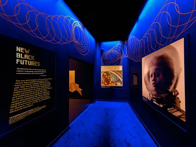 The exhibition &quot;Afrofuturism: A History of Black Futures,&quot; (above, right: A scene from the 2014 Ghanian short film &quot;Afronauts&quot;) is on view through March 24, 2024, at the Smithsonian&#39;s National Museum of African American History.
