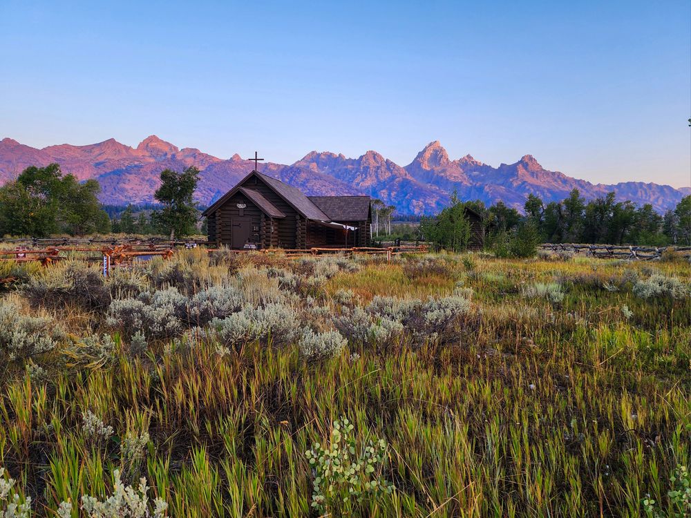 Sunrise over the Chapel of the Transfiguration in Grand Teton National Park.