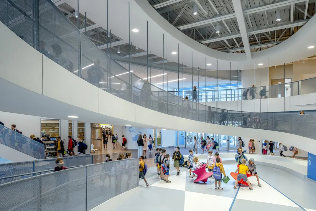 A winding ramp curls up the center of the school. Laura Peters/CannonDesign