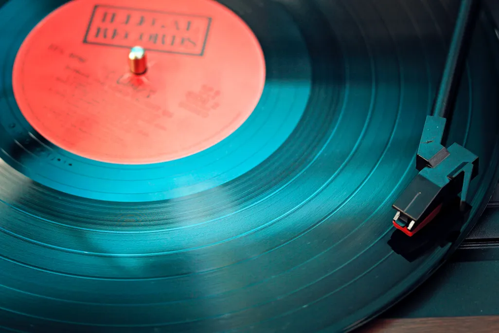 Close-up shot of vinyl record on record player