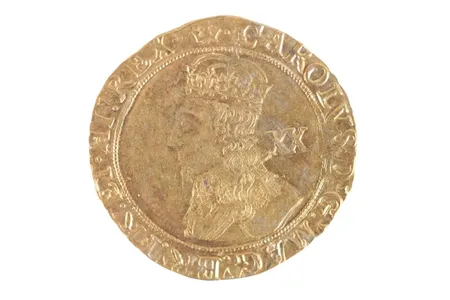 A "Charles I gold unite crown coin" generated the most money at the auction, collecting &pound;5,000 (about $6,250).