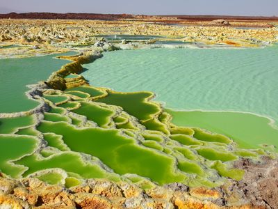 The colorful salt terraces in the Dallol region of Ethiopia are hot targets for astrobiologists seeking extreme microbial life that could resemble extraterrestrials.