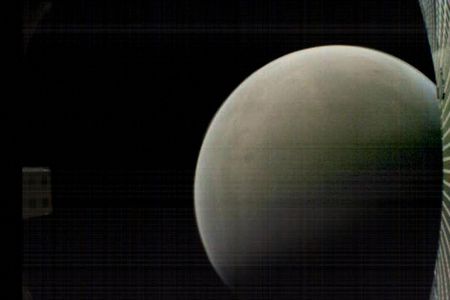 On November 26, 2018, MarCO-B returned this color image of Mars (and its own high-gain antenna) as it flew past the planet at a distance of about 4,700 miles.