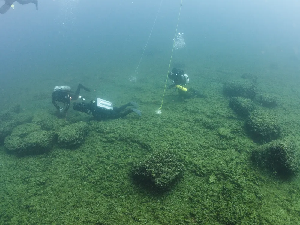 Archaeologists collect samples from a caribou hunting site on Alpena-Amberley Ridge in Lake Huron.