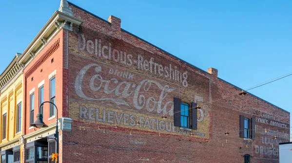 Faded Coca Cola advertisement on the side of a building thumbnail