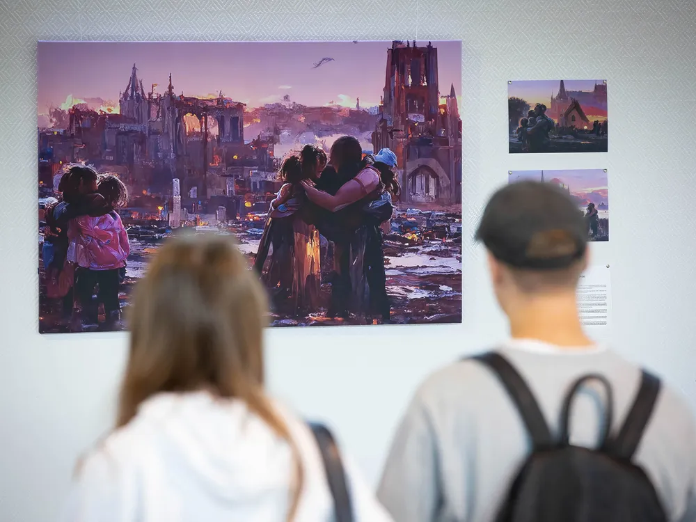 People look at a picture created based on the stories of homeless children during evacuation from hot spots in southeastern Ukraine in Kyiv.  The gallery of these images is called 