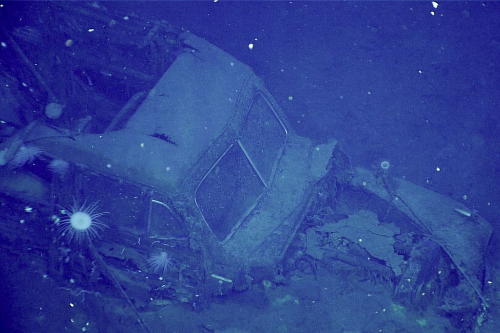 Underwater view of old car